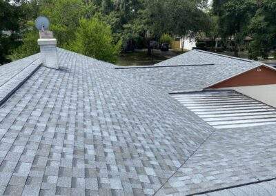 Close-up of a newly installed gray asphalt shingle roof