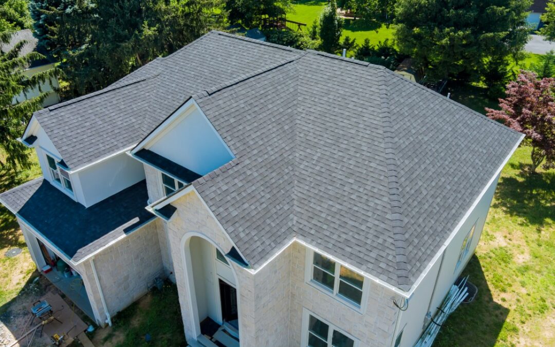 Aerial view of asphalt shingles roofing construction, the house with new window